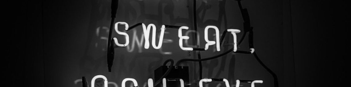 a neon sign that reads work, sweat, achieve